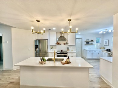 This beautifully remodeled home is truly move-in ready, offering on Wildwood Country Club in Florida - for sale on GolfHomes.com, golf home, golf lot
