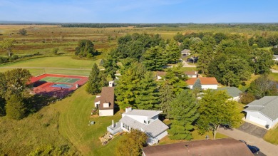 Discover contemporary charm in this beautifully designed on Saddle Ridge Golf Club in Wisconsin - for sale on GolfHomes.com, golf home, golf lot