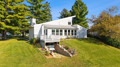 Discover contemporary charm in this beautifully designed on Saddle Ridge Golf Club in Wisconsin - for sale on GolfHomes.com, golf home, golf lot