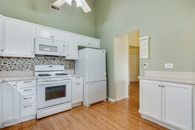 Stunning second floor unit with gorgeous panoramic golf course on The Links at Carillon in Illinois - for sale on GolfHomes.com, golf home, golf lot