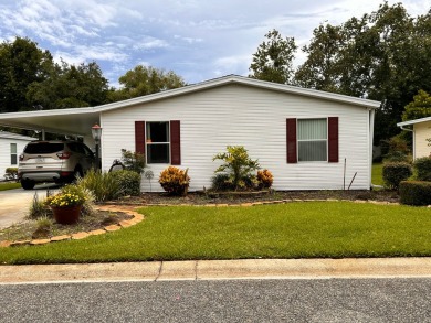 This home not only has 3 bedrooms and 2 bathrooms but a closed on Whisperwood Golf Course in Florida - for sale on GolfHomes.com, golf home, golf lot