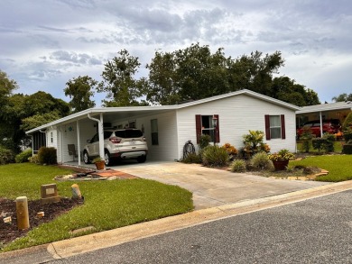 This home not only has 3 bedrooms and 2 bathrooms but a closed on Whisperwood Golf Course in Florida - for sale on GolfHomes.com, golf home, golf lot