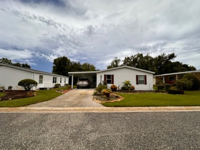 This home not only has 3 bedrooms and 2 bathrooms but a closed on Whisperwood Golf Course in Florida - for sale on GolfHomes.com, golf home, golf lot