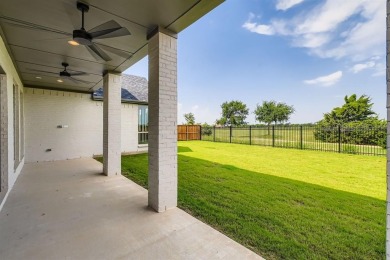 Welcome to this stunning 4-bedroom, 4.5-bathroom house, nestled on The Tribute At the Colony in Texas - for sale on GolfHomes.com, golf home, golf lot