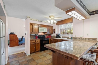 Perfectly positioned on an oversized golf course lot in the on Lake Forest Yacht and Country Club in Alabama - for sale on GolfHomes.com, golf home, golf lot