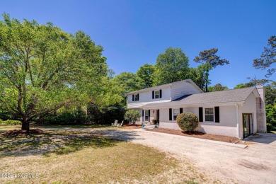 This coastal cottage is located on the prestigious Bald Eagle on Porters Neck Country Club in North Carolina - for sale on GolfHomes.com, golf home, golf lot