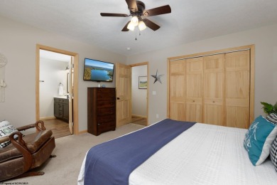 Welcome to 'Suncrest Chalet', a nearly-new escape nestled inside on Alpine Lake Resort in West Virginia - for sale on GolfHomes.com, golf home, golf lot