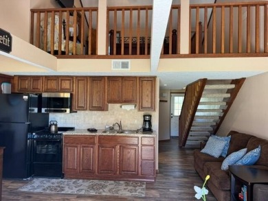 Step into luxury with this fully furnished and updated on Pointe Royale Village Country Club in Missouri - for sale on GolfHomes.com, golf home, golf lot