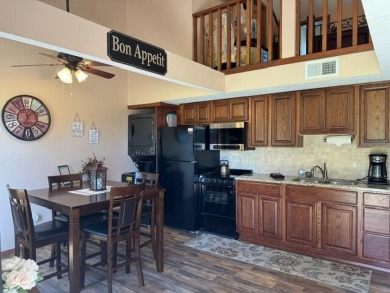 Step into luxury with this fully furnished and updated on Pointe Royale Village Country Club in Missouri - for sale on GolfHomes.com, golf home, golf lot