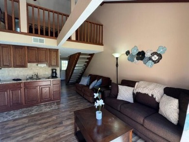Step into luxury with this fully furnished and updated on Pointe Royale Village Country Club in Missouri - for sale on GolfHomes.com, golf home, golf lot