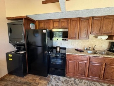 Step into luxury with this fully furnished and updated on Pointe Royale Village Country Club in Missouri - for sale on GolfHomes.com, golf home, golf lot