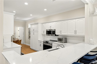 AN INSPIRED RE-DESIGN OF A BEAUTIFULLY UPDATED GOLF COTTAGE at on Oak Harbor Country Club in Florida - for sale on GolfHomes.com, golf home, golf lot