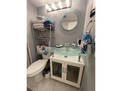 Spacious and bright 2nd floor unit in a 55+ gated community with on Indian Spring Golf and Country Club in Florida - for sale on GolfHomes.com, golf home, golf lot