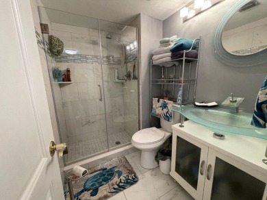 Spacious and bright 2nd floor unit in a 55+ gated community with on Indian Spring Golf and Country Club in Florida - for sale on GolfHomes.com, golf home, golf lot
