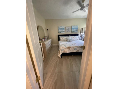 Spacious and bright 2nd floor unit in a 55+ gated community with on Indian Spring Golf and Country Club in Florida - for sale on GolfHomes.com, golf home, golf lot