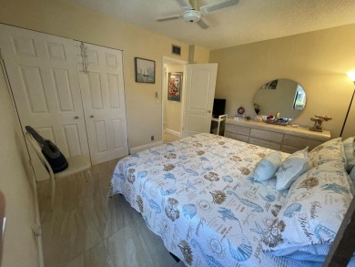 Spacious and bright 2nd floor unit in a 55+ gated community with on Indian Spring Golf and Country Club in Florida - for sale on GolfHomes.com, golf home, golf lot