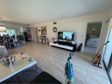 Spacious and bright 2nd floor unit in a 55+ gated community with on Indian Spring Golf and Country Club in Florida - for sale on GolfHomes.com, golf home, golf lot