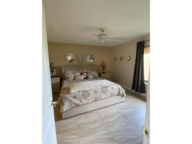 Spacious and bright 2nd floor unit in a 55+ gated community with on Indian Spring Golf and Country Club in Florida - for sale on GolfHomes.com, golf home, golf lot