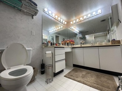 Spacious and bright 2nd floor unit in a 55+ gated community with on Indian Spring Golf and Country Club in Florida - for sale on GolfHomes.com, golf home, golf lot