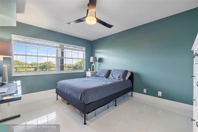 Nestled in a charming five-story condo community, this home on Palm-Aire Country Club and Resort - Palms in Florida - for sale on GolfHomes.com, golf home, golf lot