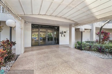 Nestled in a charming five-story condo community, this home on Palm-Aire Country Club and Resort - Palms in Florida - for sale on GolfHomes.com, golf home, golf lot