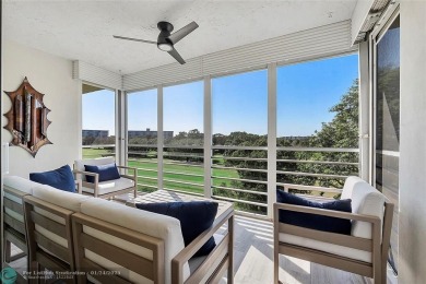 Nestled in a charming five-story condo community, this home on Palm-Aire Country Club and Resort - Palms in Florida - for sale on GolfHomes.com, golf home, golf lot