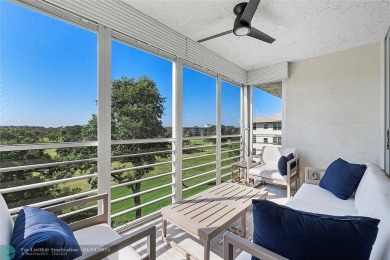 Nestled in a charming five-story condo community, this home on Palm-Aire Country Club and Resort - Palms in Florida - for sale on GolfHomes.com, golf home, golf lot