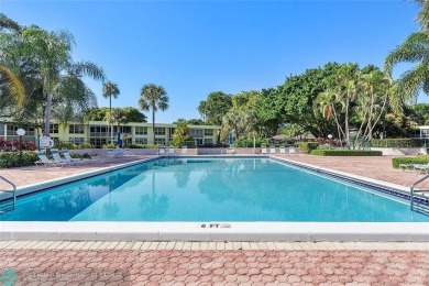 Nestled in a charming five-story condo community, this home on Palm-Aire Country Club and Resort - Palms in Florida - for sale on GolfHomes.com, golf home, golf lot