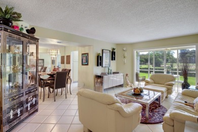 WELCOME TO THIS CONVENIENT 1ST FLOOR CONDO WITH BEAUTIFUL WATER on Poinciana Golf Club in Florida - for sale on GolfHomes.com, golf home, golf lot