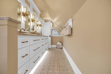 Elegant Waterfront Living in Plantation Community! Nestled on The Patriot Golf Club At Grand Harbor in South Carolina - for sale on GolfHomes.com, golf home, golf lot