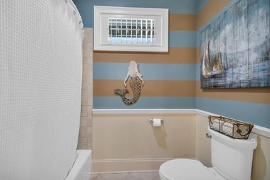 Elegant Waterfront Living in Plantation Community! Nestled on The Patriot Golf Club At Grand Harbor in South Carolina - for sale on GolfHomes.com, golf home, golf lot