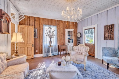 This charming cottage and guest house on the second block of on The Bridges Golf Club At Hollywood Casino in Mississippi - for sale on GolfHomes.com, golf home, golf lot