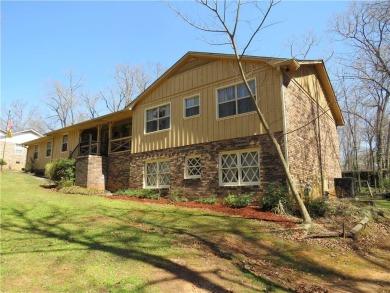 Sprawling brick ranch over full basement located in great area on Cherokee Golf and Country Club in Georgia - for sale on GolfHomes.com, golf home, golf lot