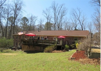Sprawling brick ranch over full basement located in great area on Cherokee Golf and Country Club in Georgia - for sale on GolfHomes.com, golf home, golf lot