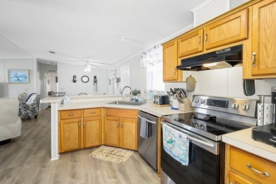 Well-designed 3/2 split bedroom home featuring spacious living on Barefoot Bay Golf Course in Florida - for sale on GolfHomes.com, golf home, golf lot