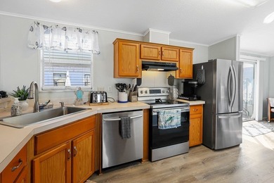 Well-designed 3/2 split bedroom home featuring spacious living on Barefoot Bay Golf Course in Florida - for sale on GolfHomes.com, golf home, golf lot