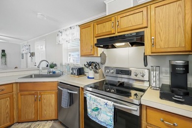 Well-designed 3/2 split bedroom home featuring spacious living on Barefoot Bay Golf Course in Florida - for sale on GolfHomes.com, golf home, golf lot