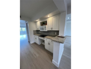 Rare Oversized Corner Unit in Century Village 55+ - 2 on Flamingo Lakes Country Club in Florida - for sale on GolfHomes.com, golf home, golf lot
