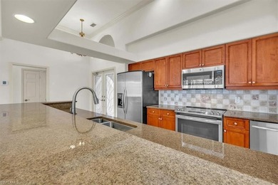 Welcome Home to Longshore Lake! From the moment you step inside on Quail Village Golf Course in Florida - for sale on GolfHomes.com, golf home, golf lot