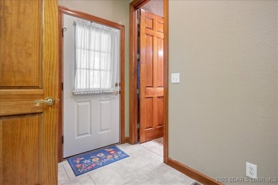 Discover the perfect blend of elegance and comfort in this on The Oaks Golf Course in Missouri - for sale on GolfHomes.com, golf home, golf lot
