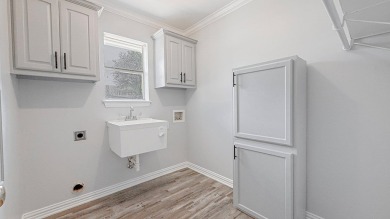 This exceptionally-updated 3 bedroom, 3 bathroom brick home in on Cedar Creek Country Club in Texas - for sale on GolfHomes.com, golf home, golf lot