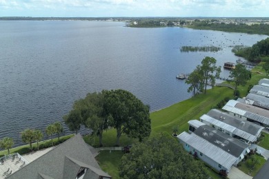 This well maintained 2 bedroom2 bath, 1988 Homes of Merit sits on Lake Henry Golf Club in Florida - for sale on GolfHomes.com, golf home, golf lot