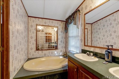 Discover comfort, convenience, and community in this 3-bedroom on River Ridge Golf Club in Virginia - for sale on GolfHomes.com, golf home, golf lot
