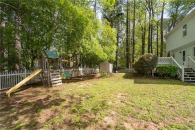 This charming 4-bedroom, 2.5-bathroom home offers both comfort on Canongate On White Oak Golf Course in Georgia - for sale on GolfHomes.com, golf home, golf lot