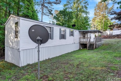 Discover comfort, convenience, and community in this 3-bedroom on River Ridge Golf Club in Virginia - for sale on GolfHomes.com, golf home, golf lot