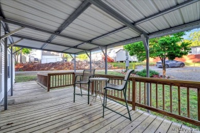 Discover comfort, convenience, and community in this 3-bedroom on River Ridge Golf Club in Virginia - for sale on GolfHomes.com, golf home, golf lot