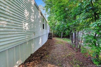 Discover comfort, convenience, and community in this 3-bedroom on River Ridge Golf Club in Virginia - for sale on GolfHomes.com, golf home, golf lot