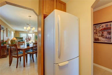 Cozy Plan B 2-bed/2-bath condo with panoramic golf and lake on The American Golf Club in Florida - for sale on GolfHomes.com, golf home, golf lot