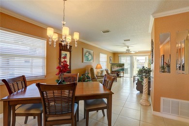 Cozy Plan B 2-bed/2-bath condo with panoramic golf and lake on The American Golf Club in Florida - for sale on GolfHomes.com, golf home, golf lot