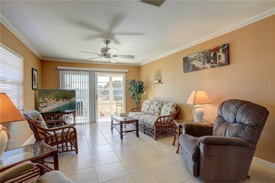 Cozy Plan B 2-bed/2-bath condo with panoramic golf and lake on The American Golf Club in Florida - for sale on GolfHomes.com, golf home, golf lot